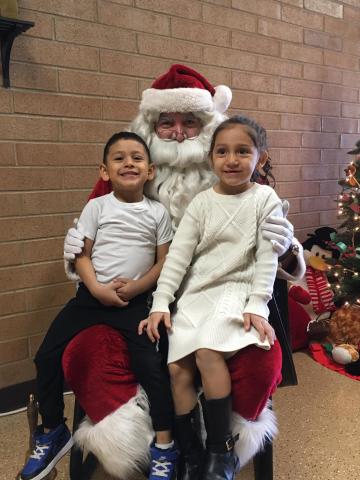 Santa with two siblings on his lap