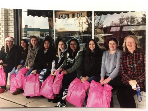 Students with pink shopping bags