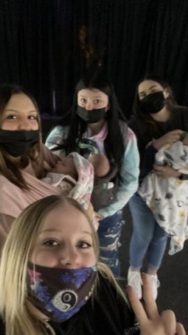 Selfie of four students wearing masks