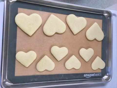 Heart shaped cookies on a baking sheet