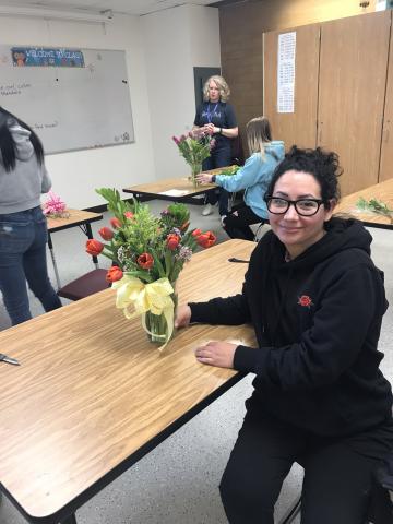 student with finished bouquet