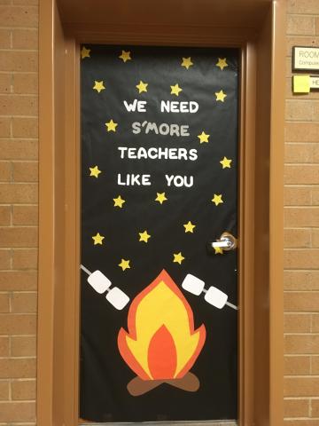 S'mores themed door with wording, "We need s'more teachers like you!"