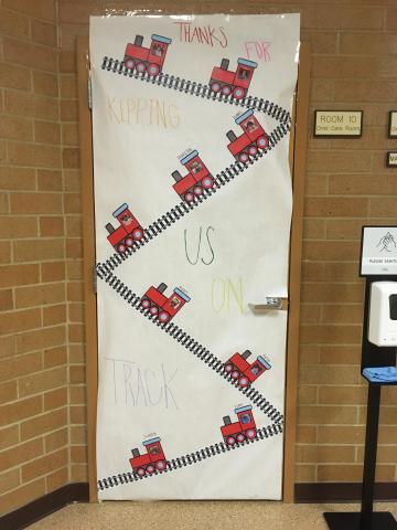 Train themed door with wording, "Thanks for keeping us on track!"