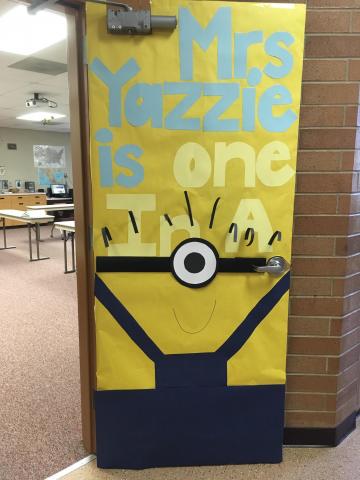 Minion themed door with wording, "Mrs. Yazzie is one in a minion!"