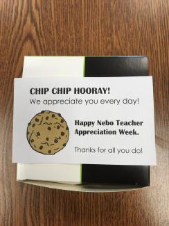white and black box with paper label expressing appreciation for teachers